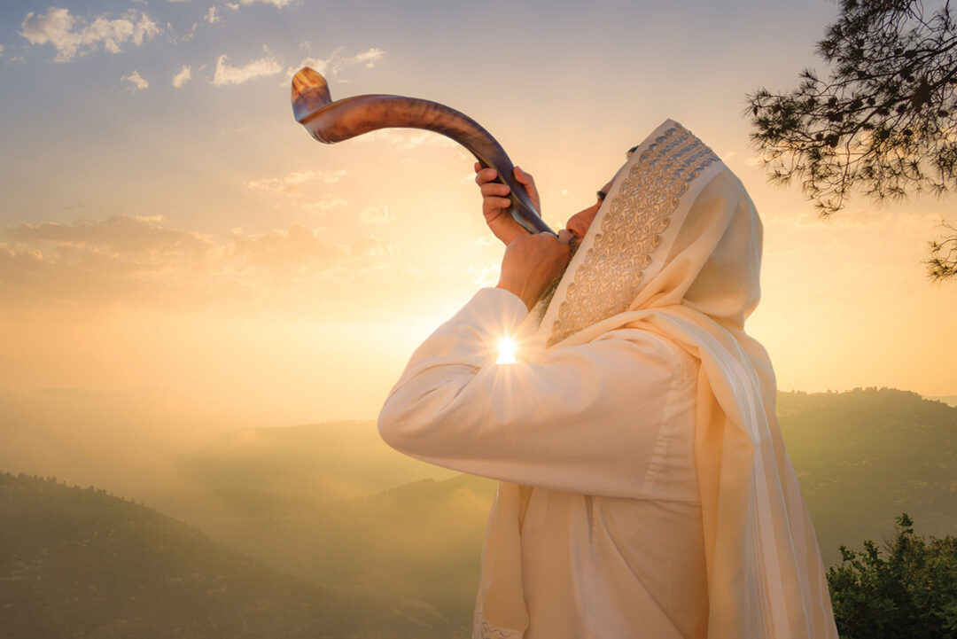 A man blowing a shofar.